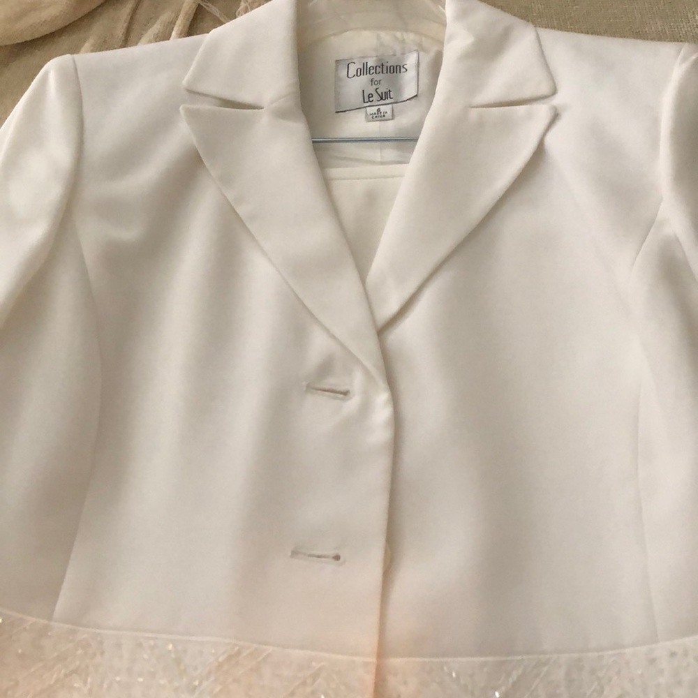 White suit.  Jacket and skirt.